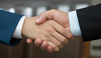 Two businesspeople shaking hands