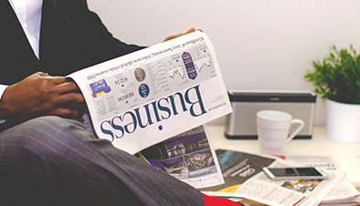 Businessman reading newspaper